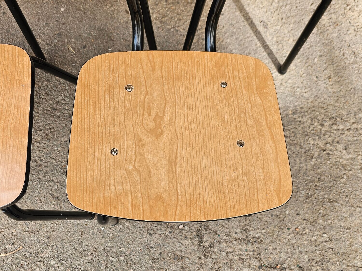 Chairs in black and light brown formica