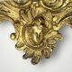 Antique bronze wall sconce with two candlesticks and beveled mirror