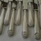 12 knives with silver-plated handles.