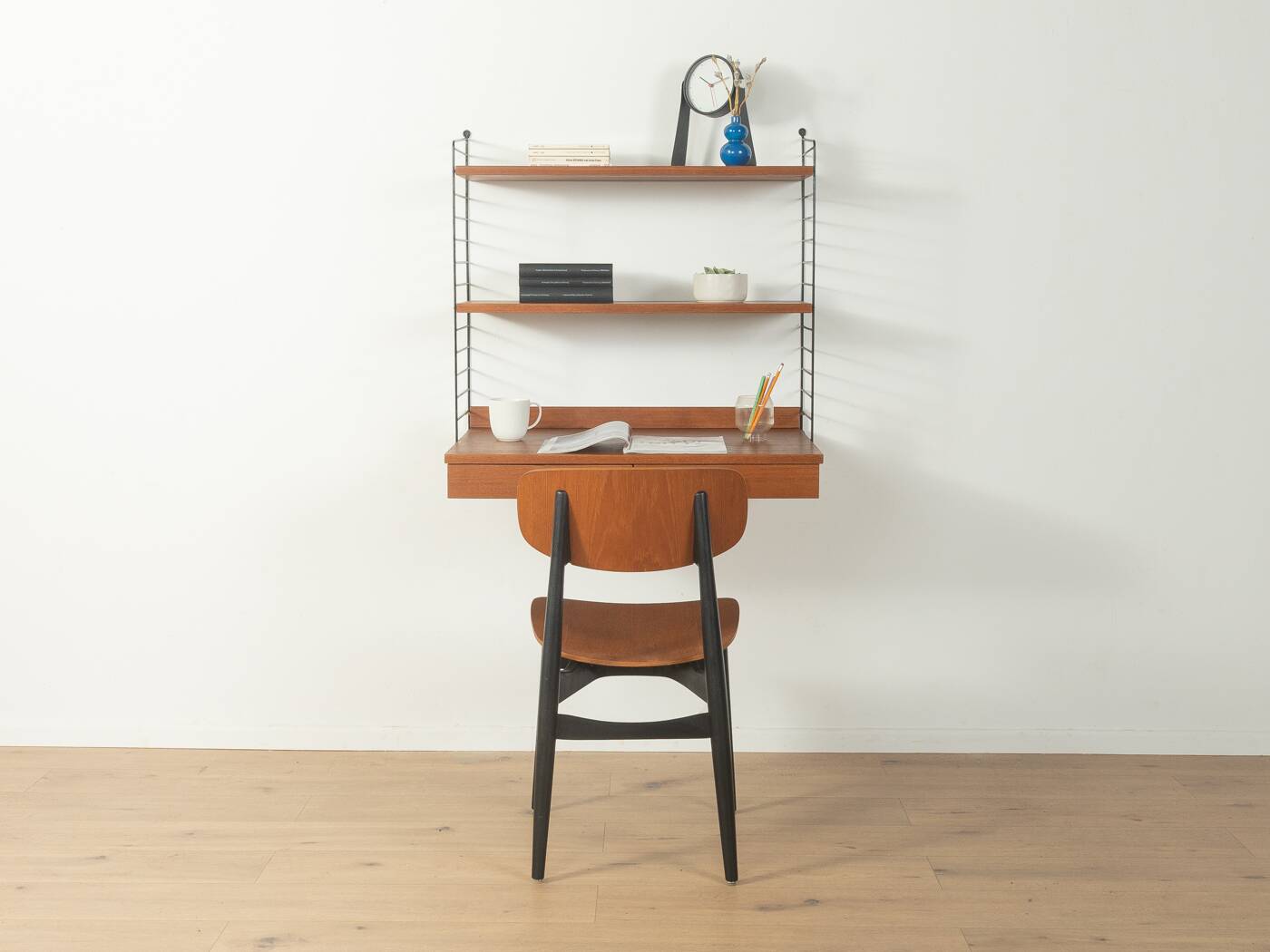 Original String shelf by Nils Strinning in teak veneer, 1949