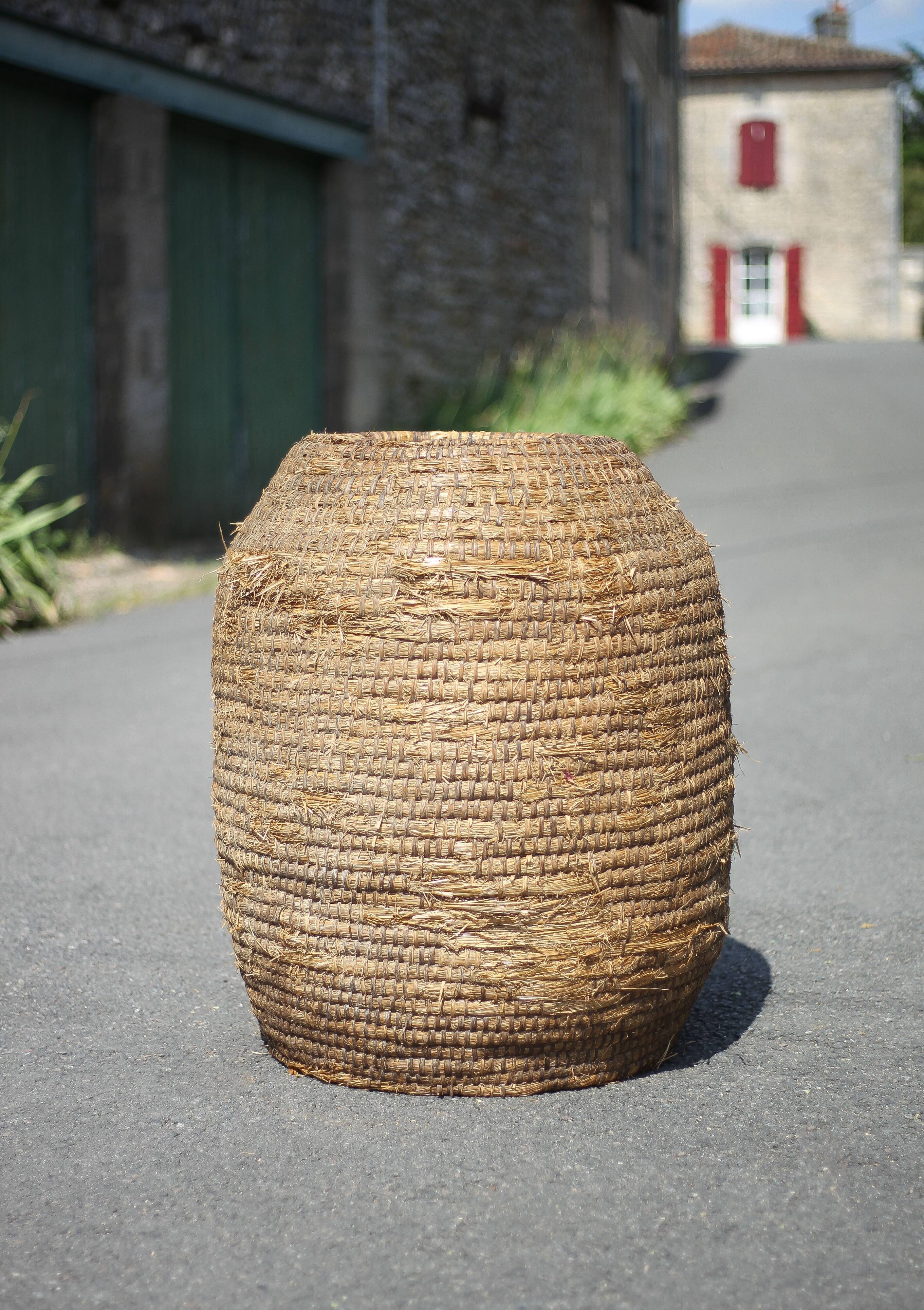 Very large old basket, burgundy straw and bramble, woven basket