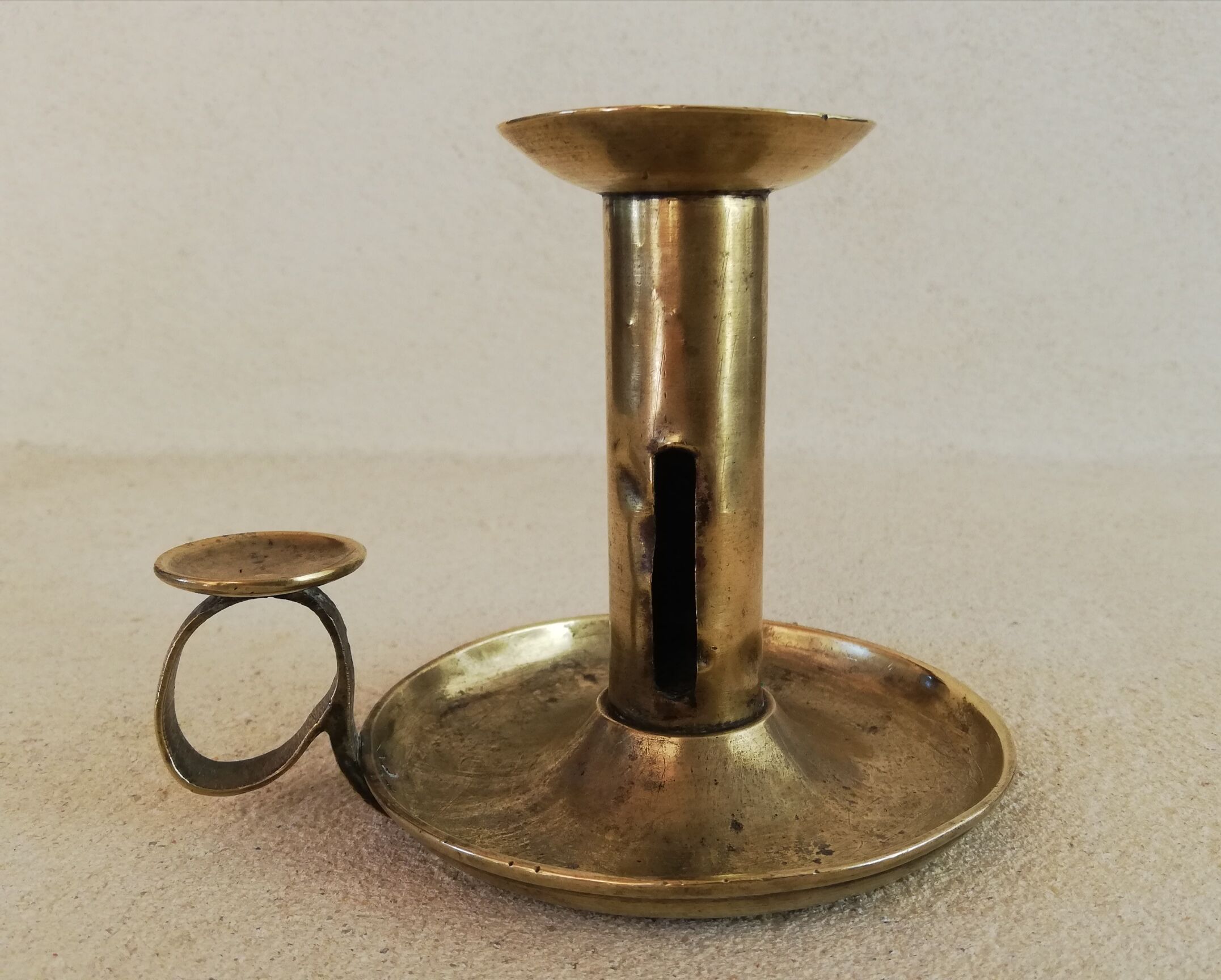 Brass hand candle holder