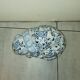 Vintage white and blue porcelain lying cat