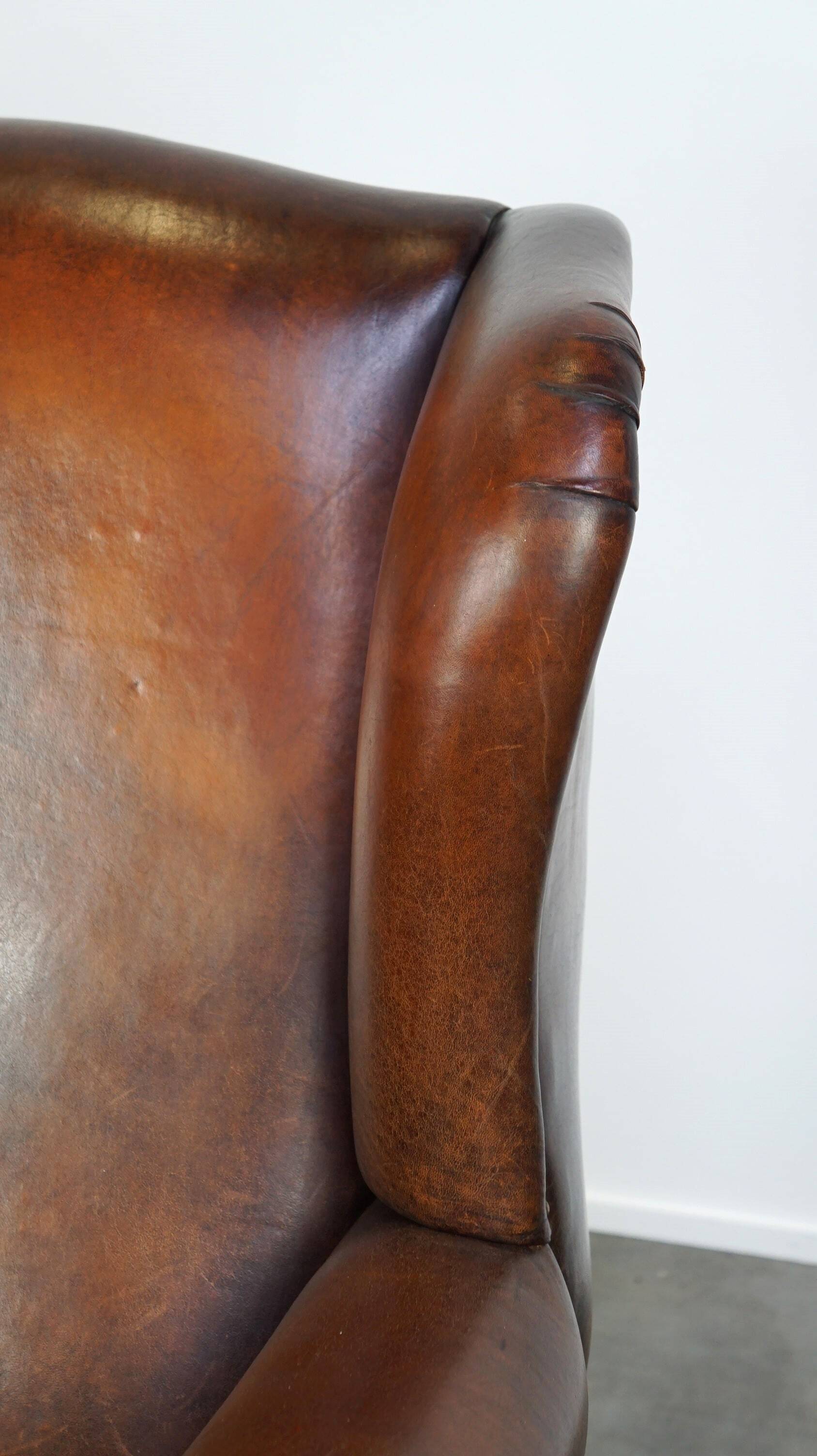Large sheepskin wing chair with excellent colour and great seating comfort