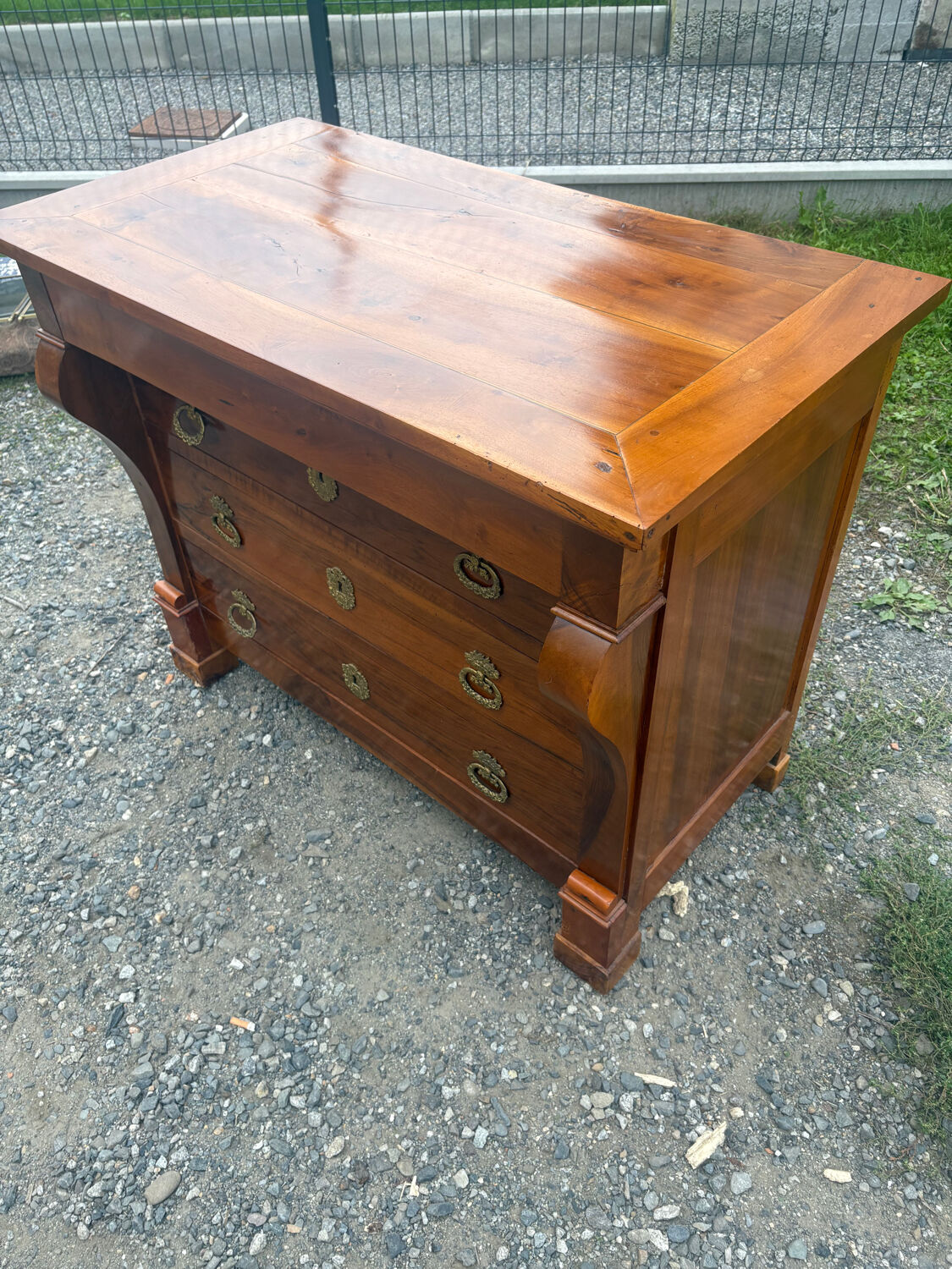 Restoration period walnut chest of drawers with a scroll handle