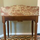 Art Deco console in walnut and marble.