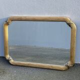 Miroir doré contour ligné