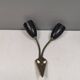 Older wall lamp with black metal shades and brass bend ‘arms’