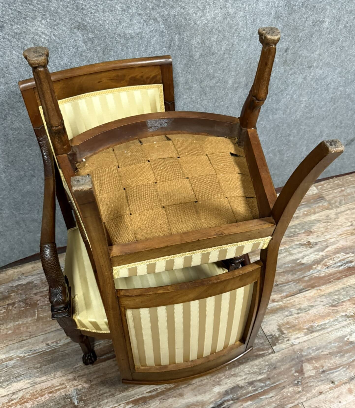 Pair of Empire period mahogany dolphin armchairs
