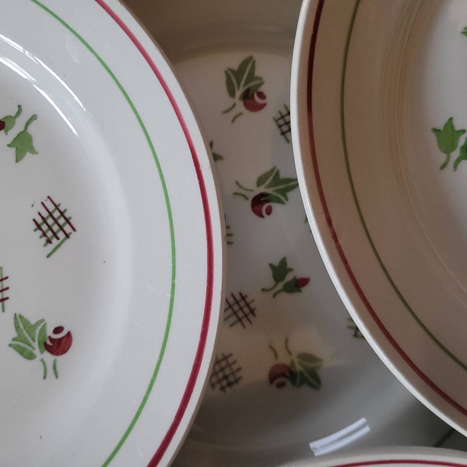 11 dinner plates decorated with stylized roses. 1950s. 11 dinner plates