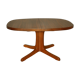 Oval walnut table with extension cords
