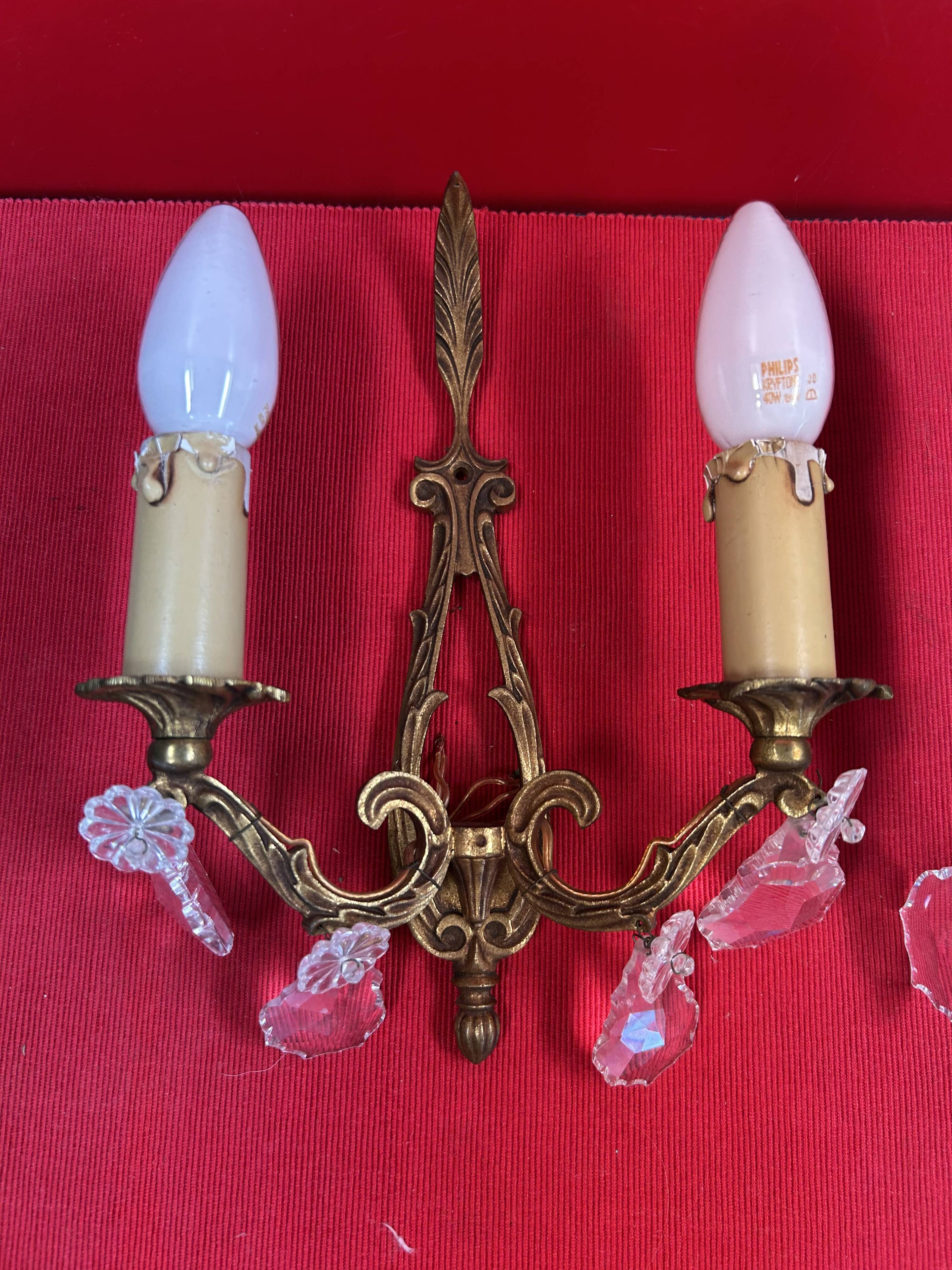 Pair of Louis XVI style wall lights, gilded bronze