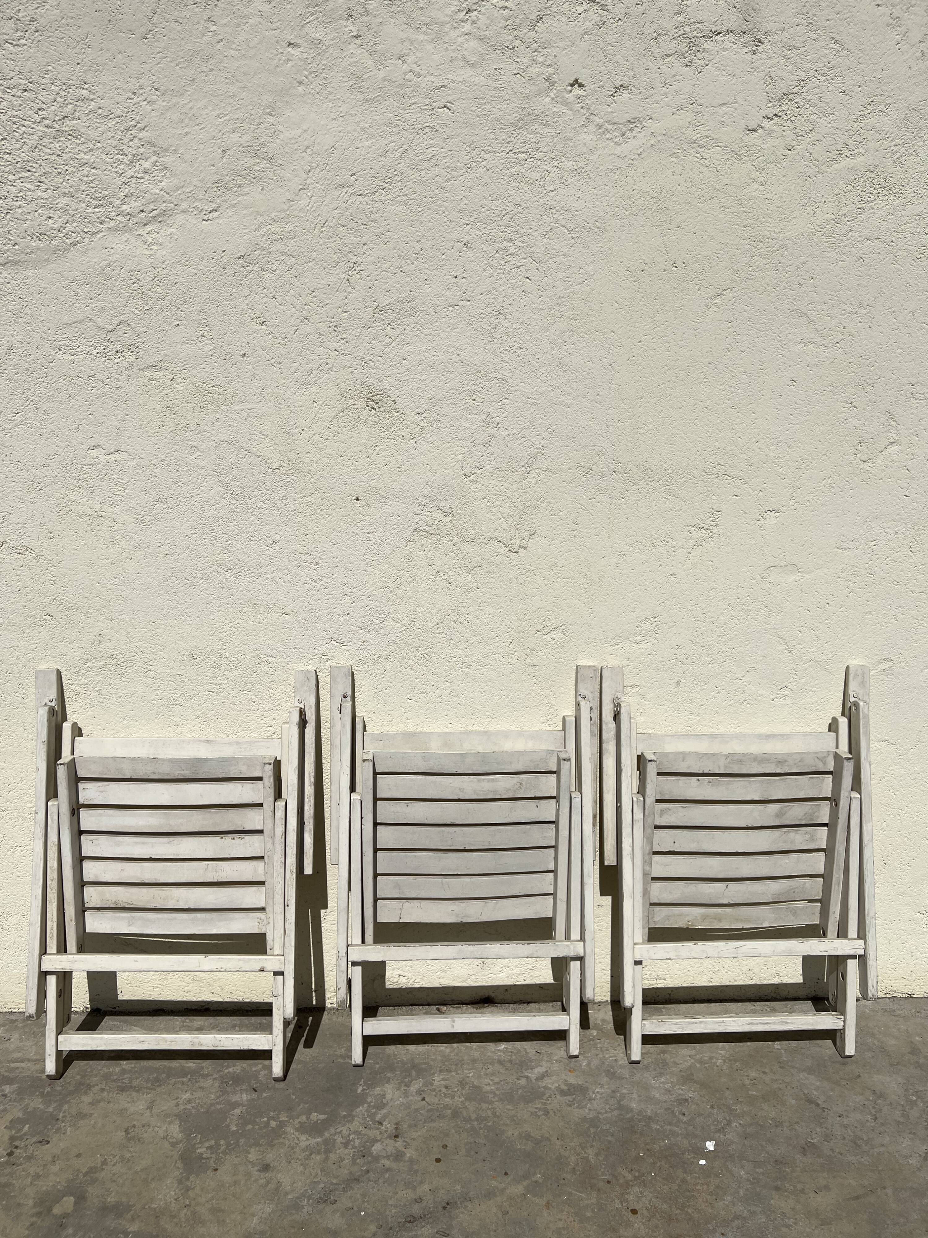 Folding wooden armchairs