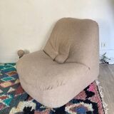 Vintage armchair reupholstered in boucle fabric.