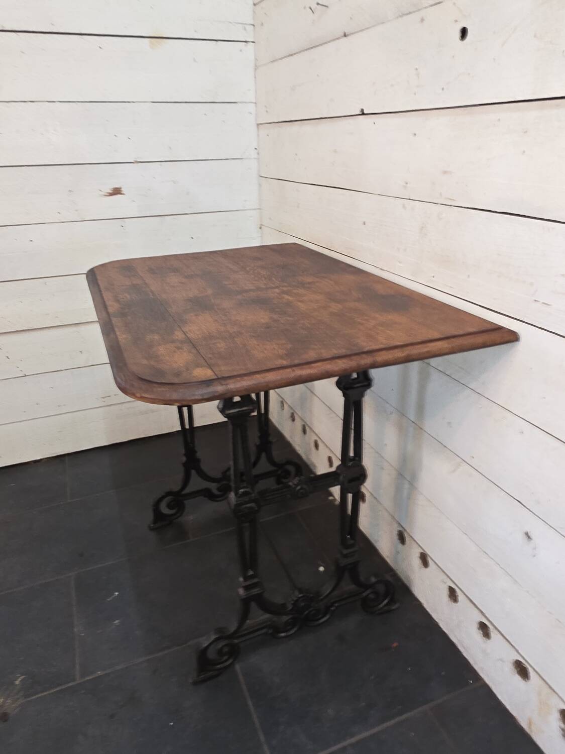 Bistro table with cast iron legs and oak top