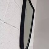 Free-form rearview mirror in black metal
