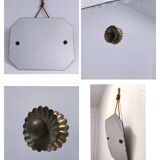 Octagonal mirror with brass hubcaps from the 60s