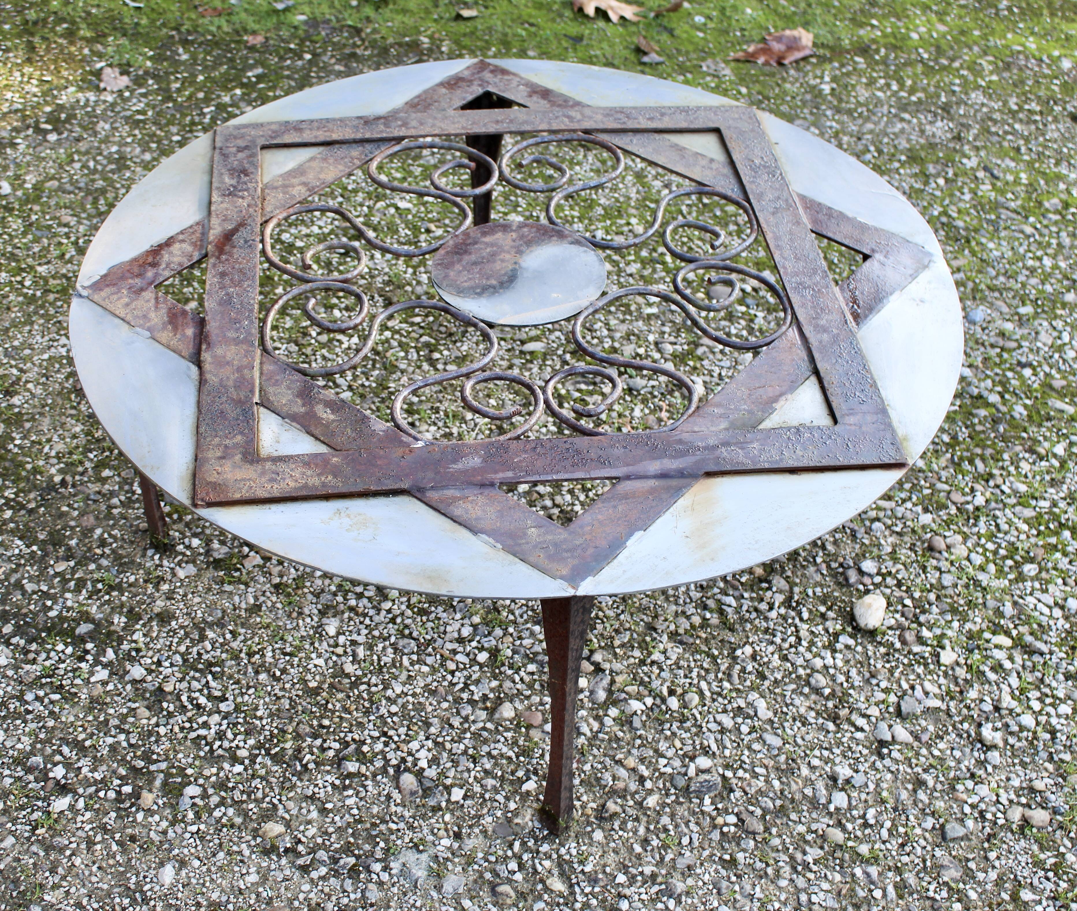 Outdoor iron table with yin yang decoration