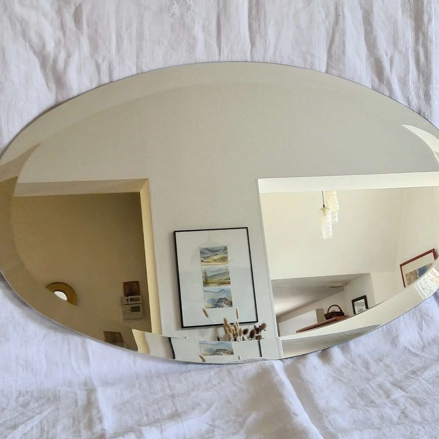 Beveled oval mirror