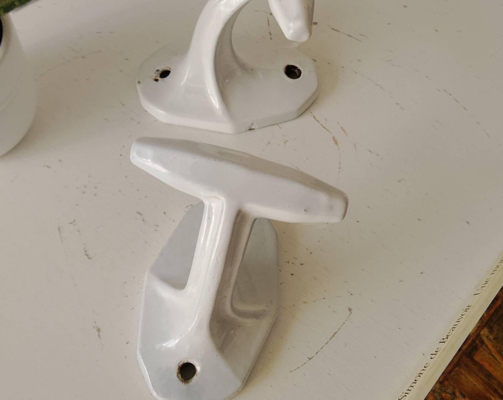 Antique Art Deco wall coat hook in enamelled cast iron.