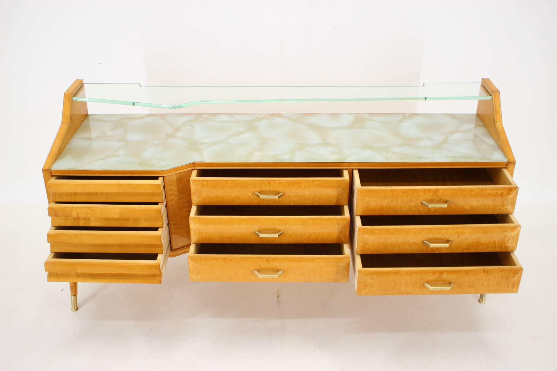 1960s italian sideboard/chest of drawers in high gloss finish with glass top and shelf
