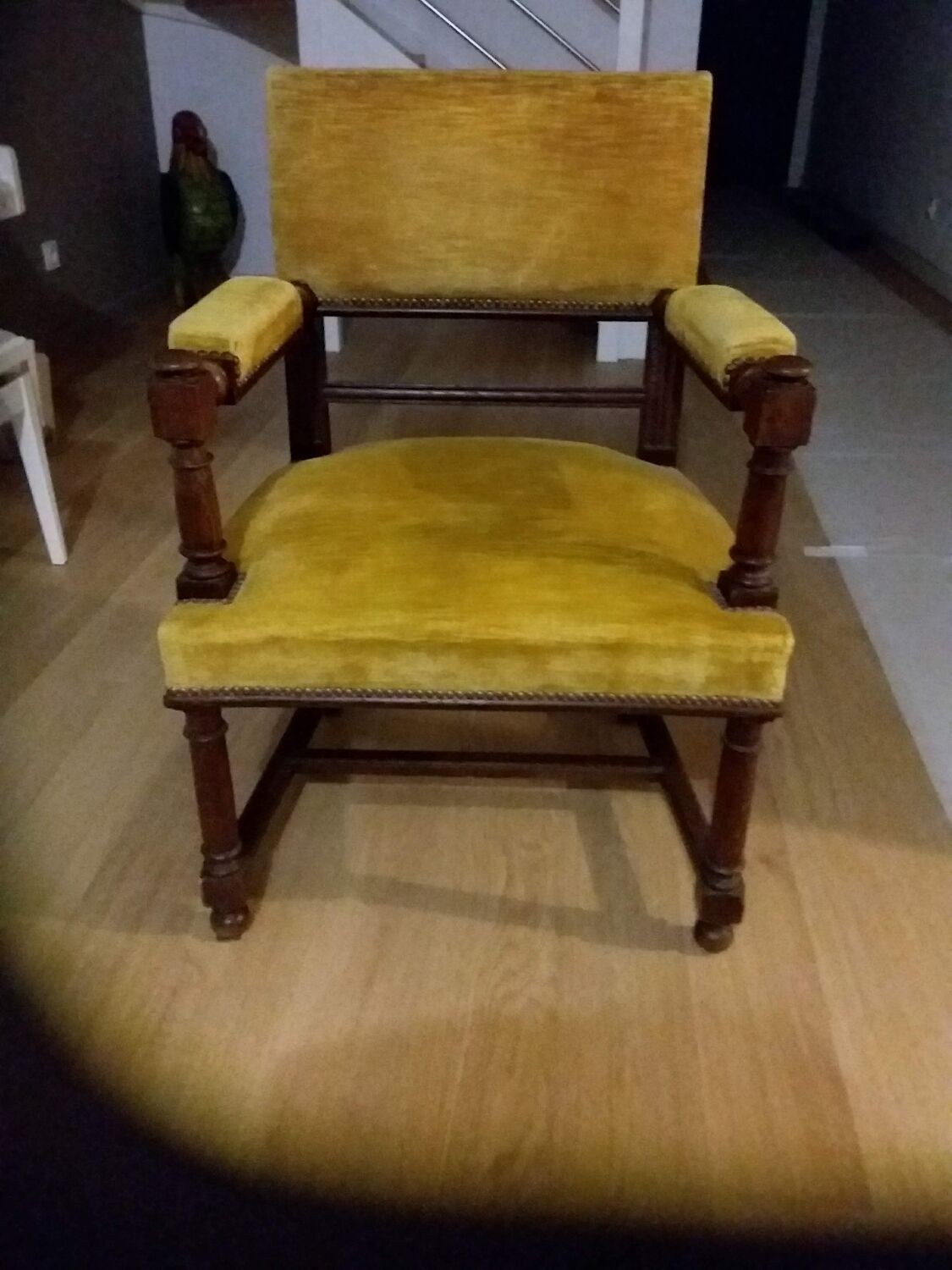Mustard yellow wooden and velvet armchair
