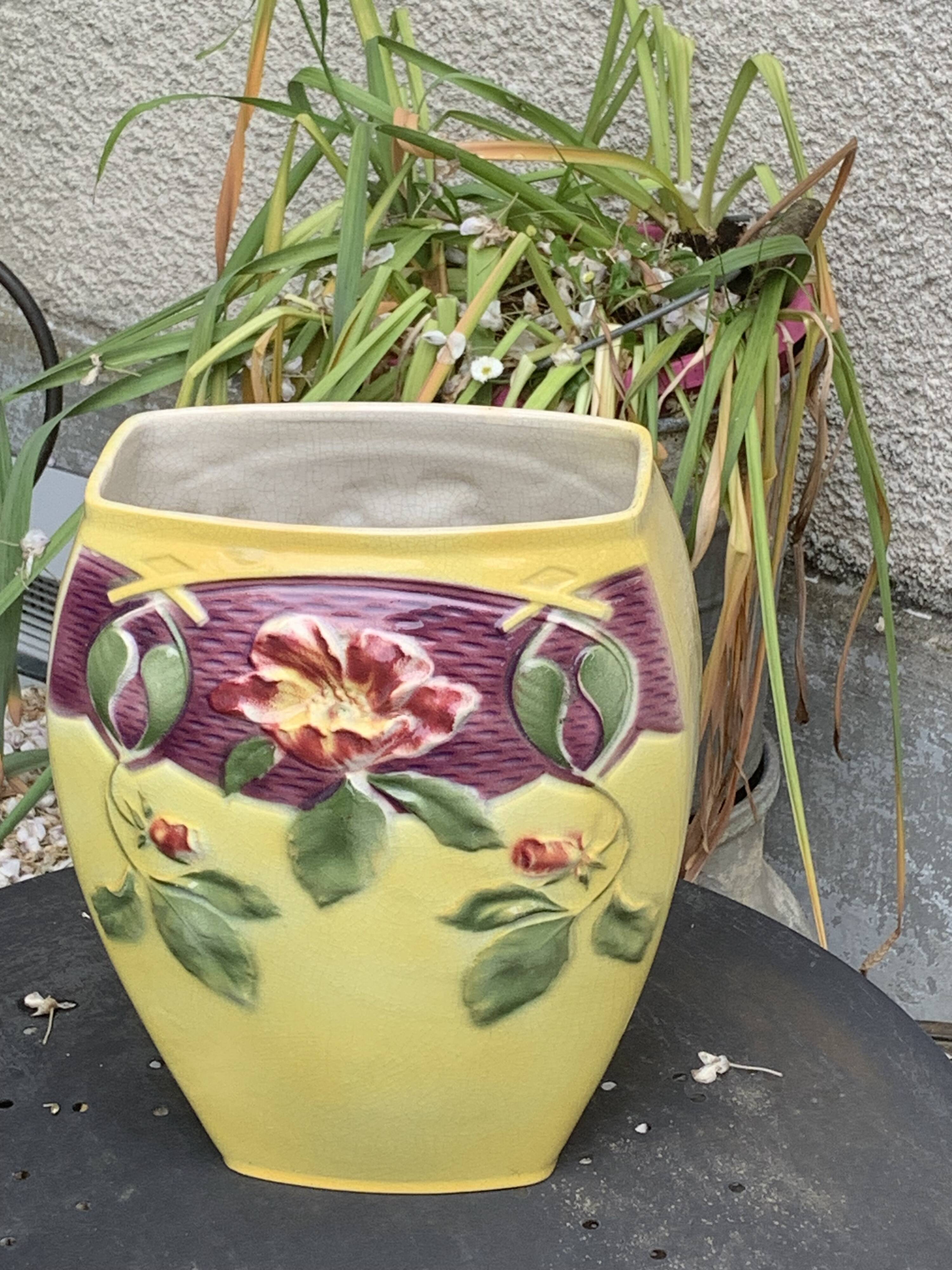 Yellow glazed ceramic slip vase with hawthorn pink flower motif