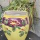 Yellow glazed ceramic slip vase with hawthorn pink flower motif