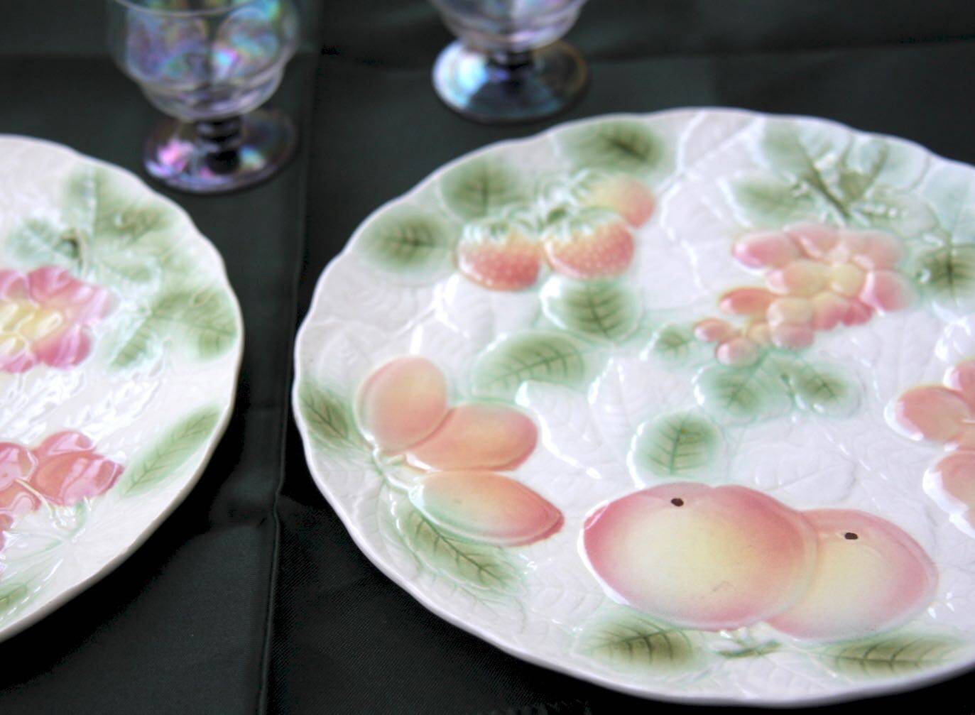 Two slip plates decorated with fruit.