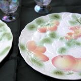 Two slip plates decorated with fruit.