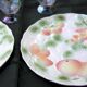 Two slip plates decorated with fruit.