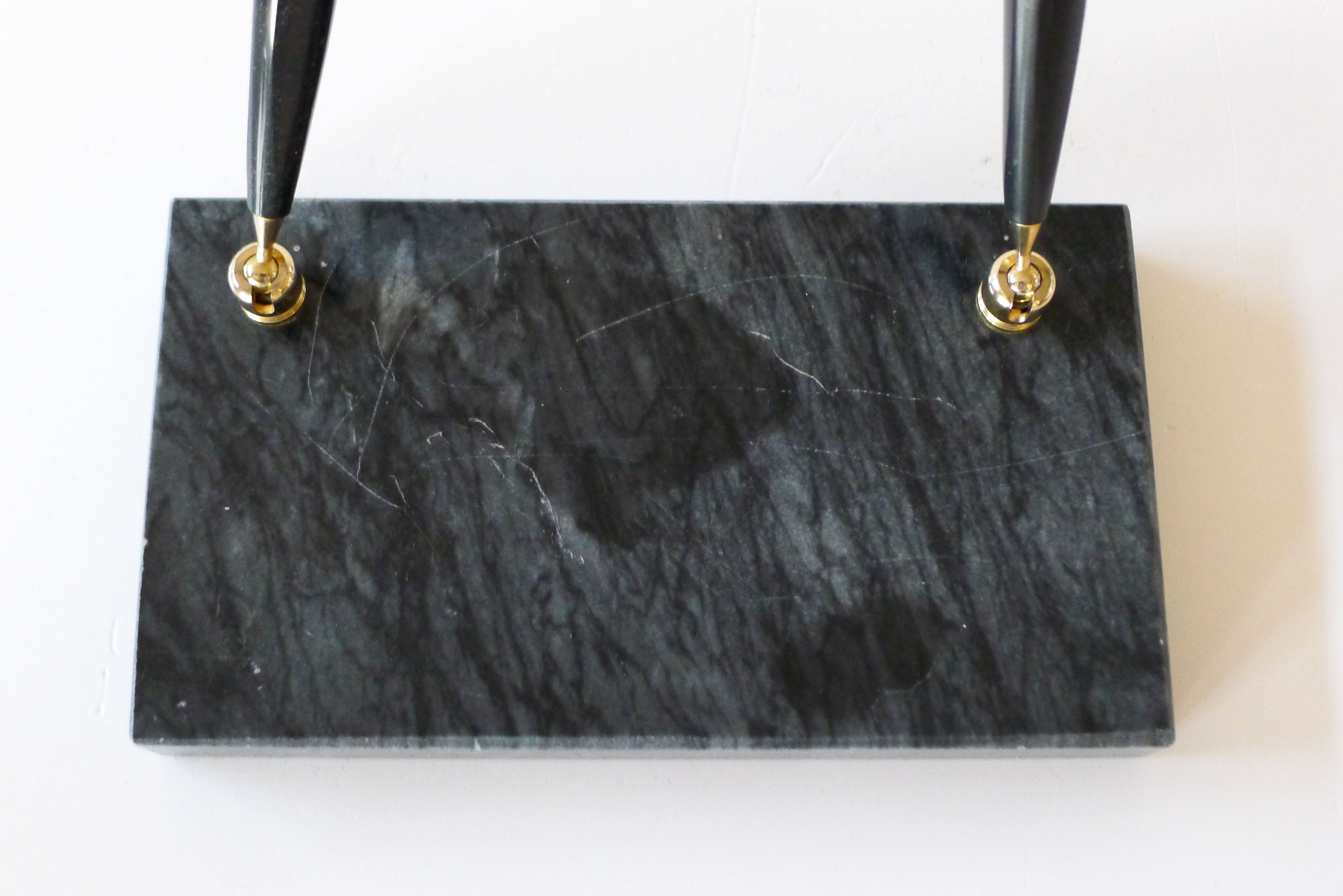 Pen doors on marble base