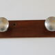 Wooden and stainless steel coat holders from the 1920s