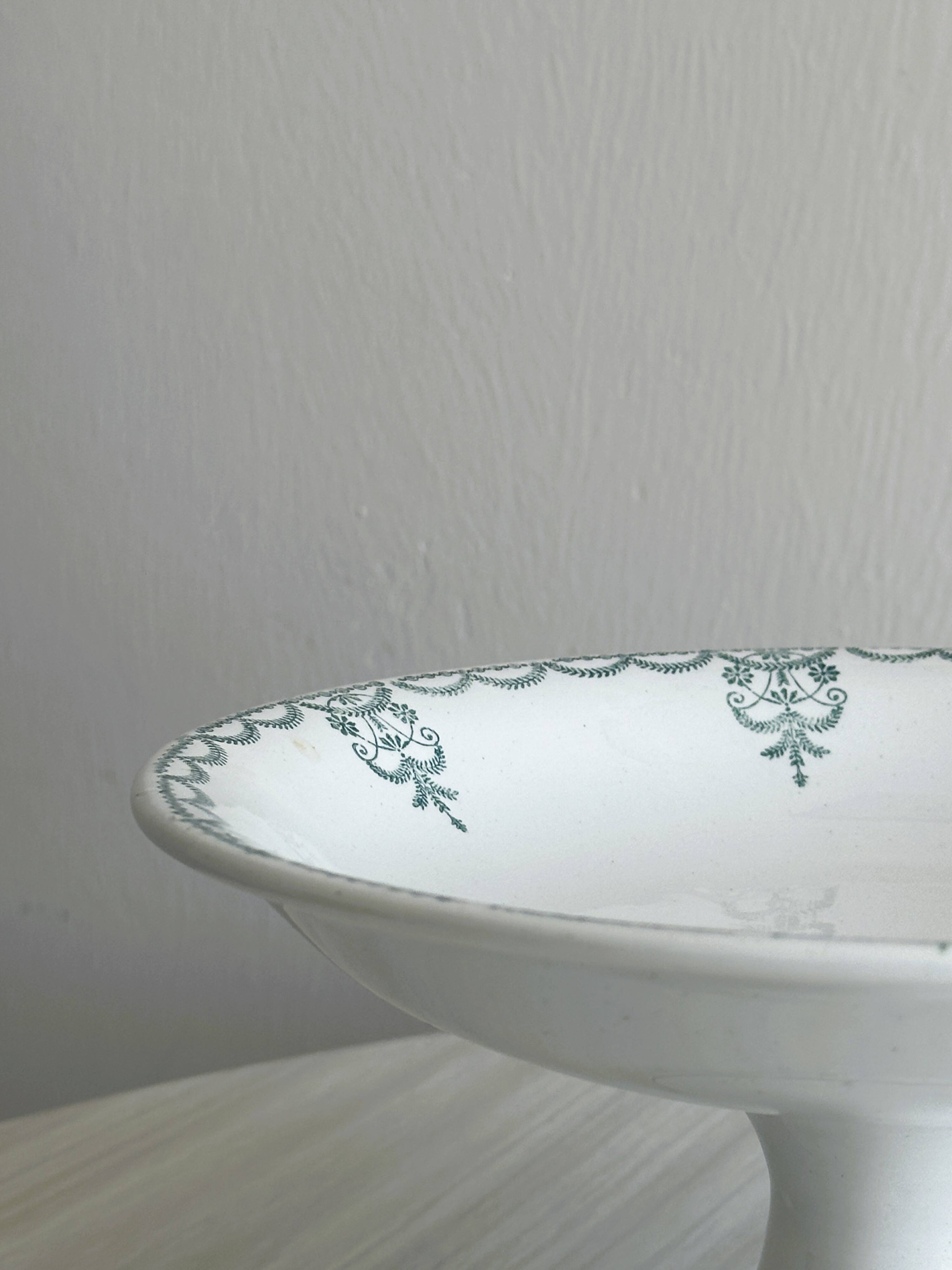 Earthenware fruit bowl on foot