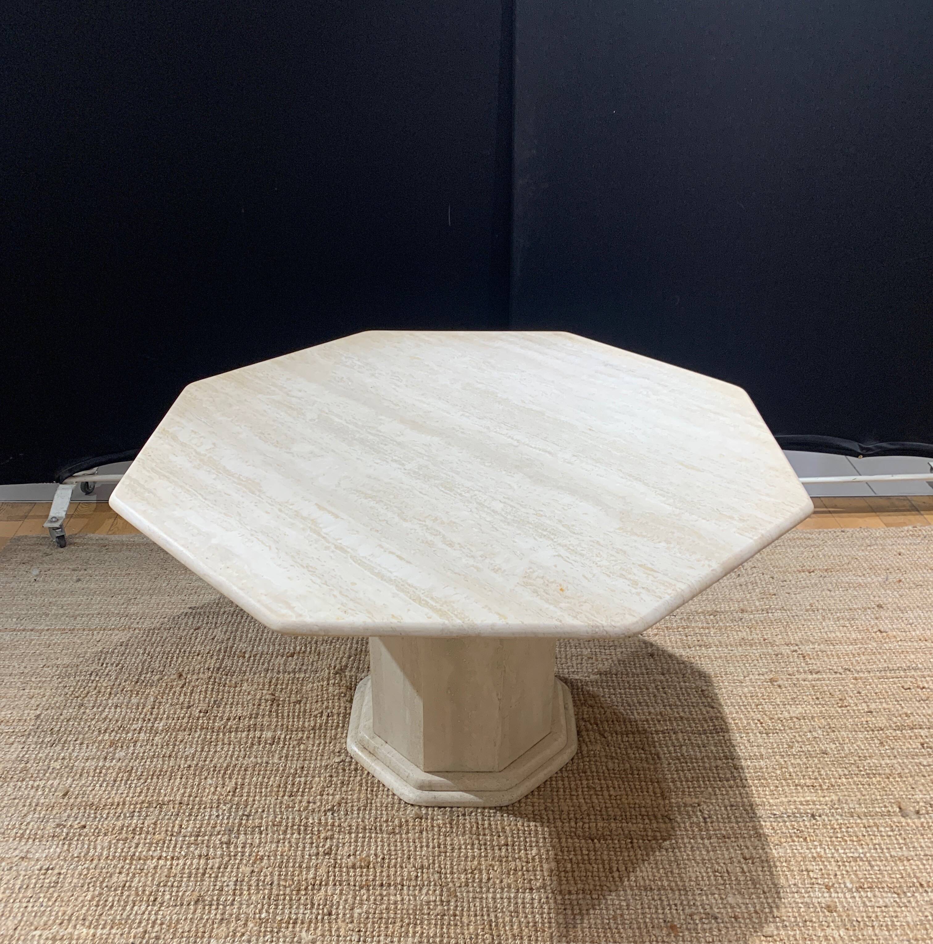 Octagonal table in light travertine