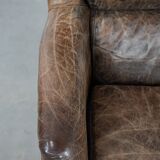 Very comfortable vintage cow leather armchair with character