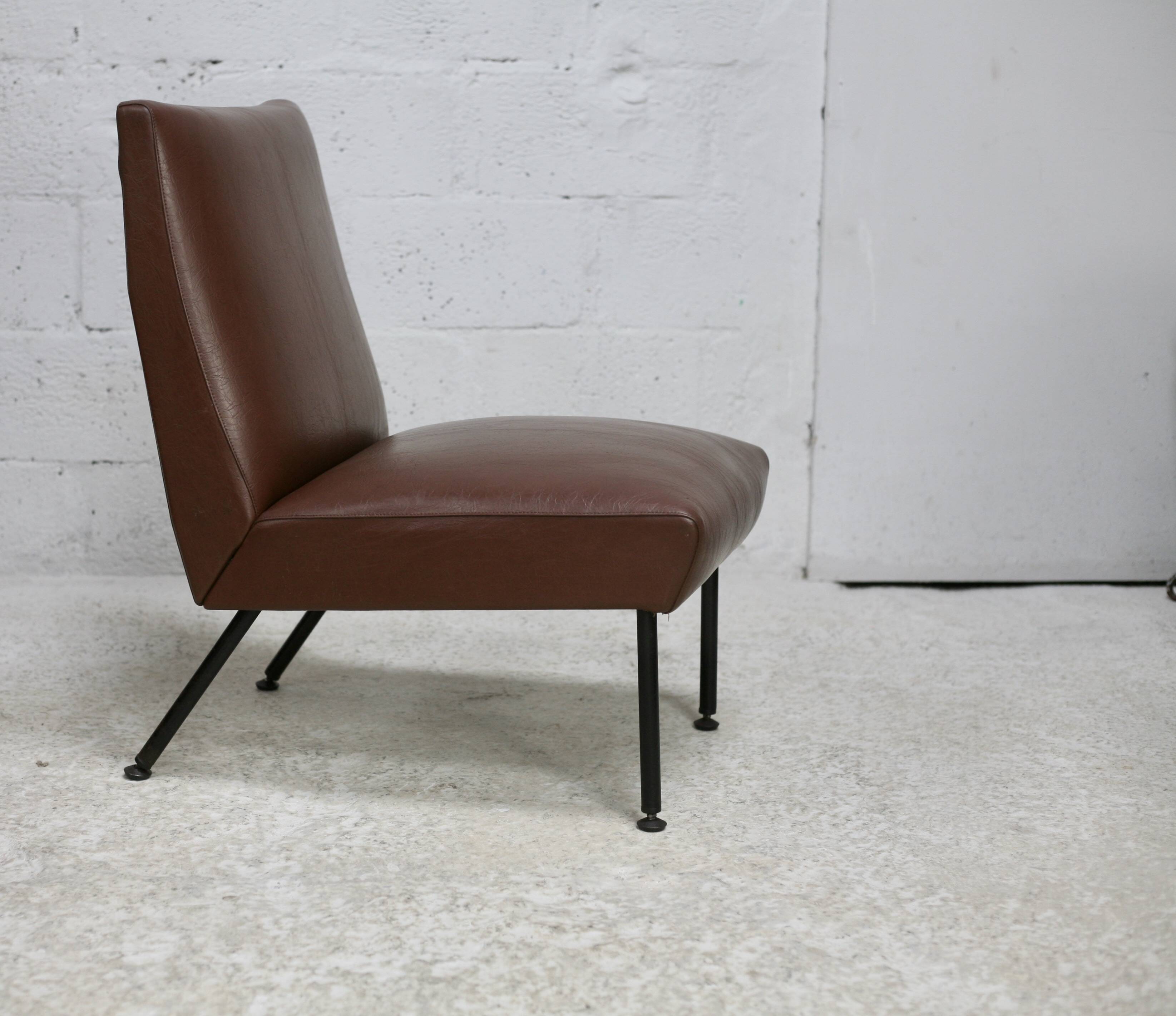 Low chair, circa 1950. Brown imitation leather.