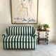 Small green striped sofa