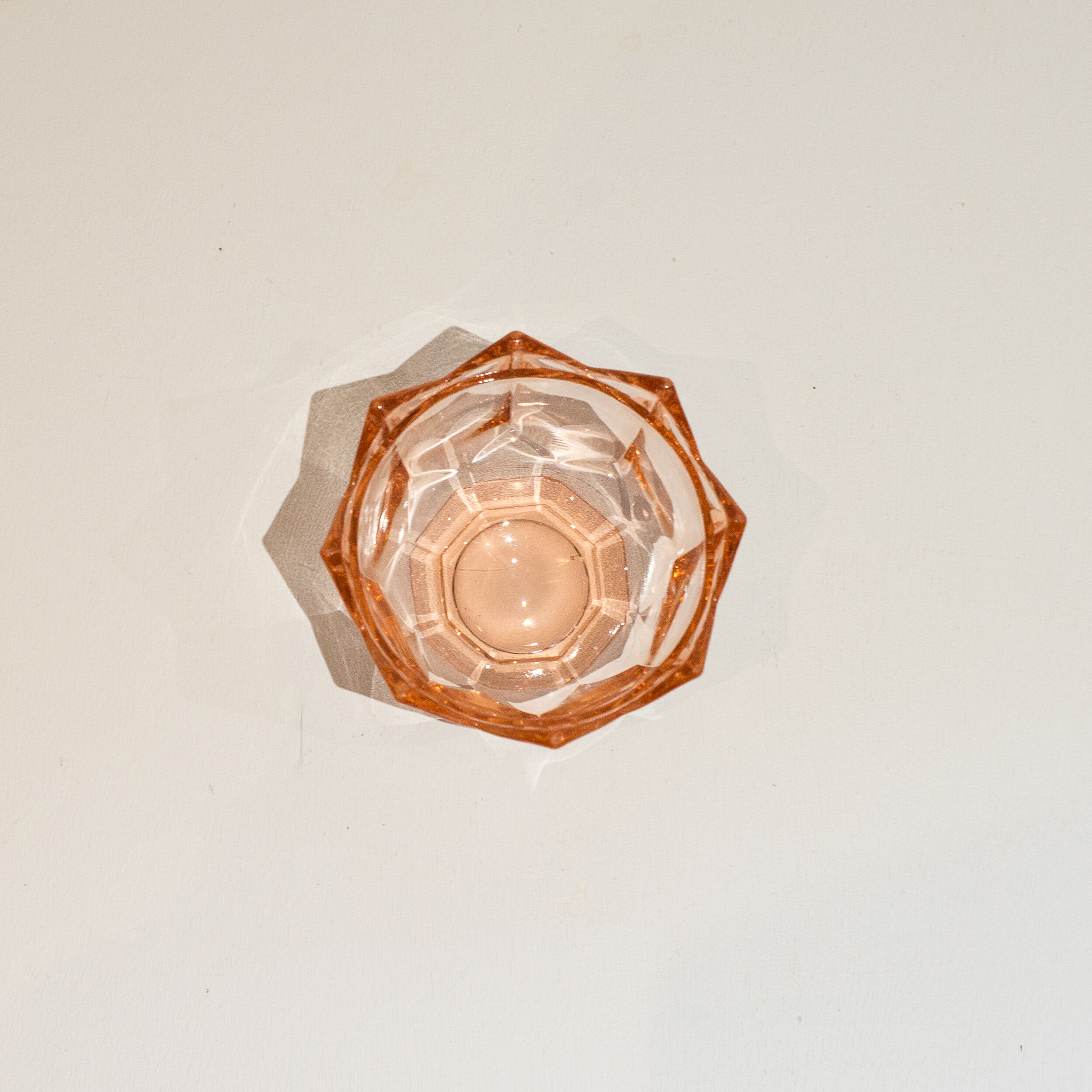 Empty pink glass jar pocket