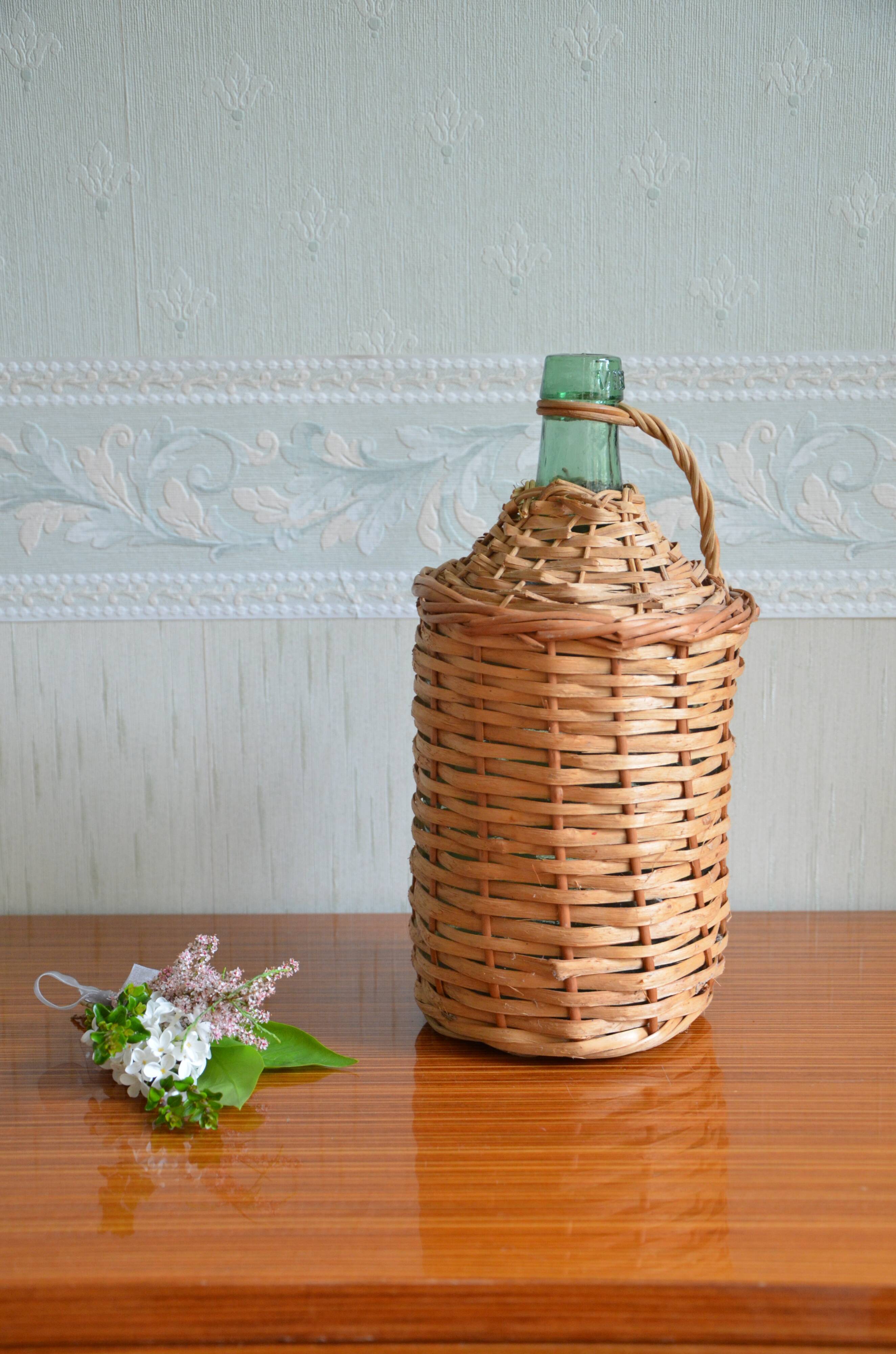 Viresa glass bottle and woven rattan