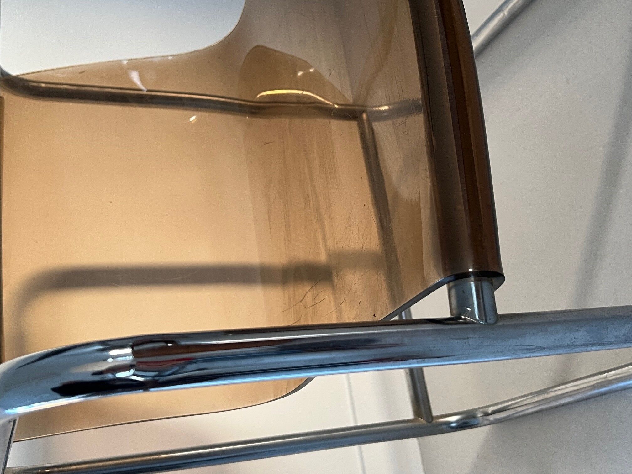 Armchair in chrome tubular metal and smoked plexiglass