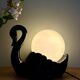 Vintage lamp, black ceramic swan and white opaline globe