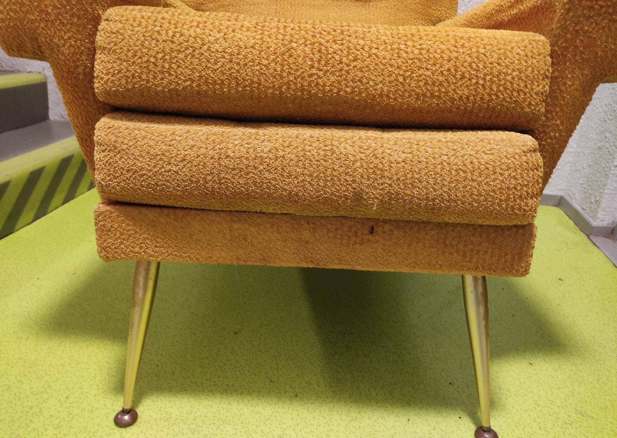 Old velvet heating chair on metal legs