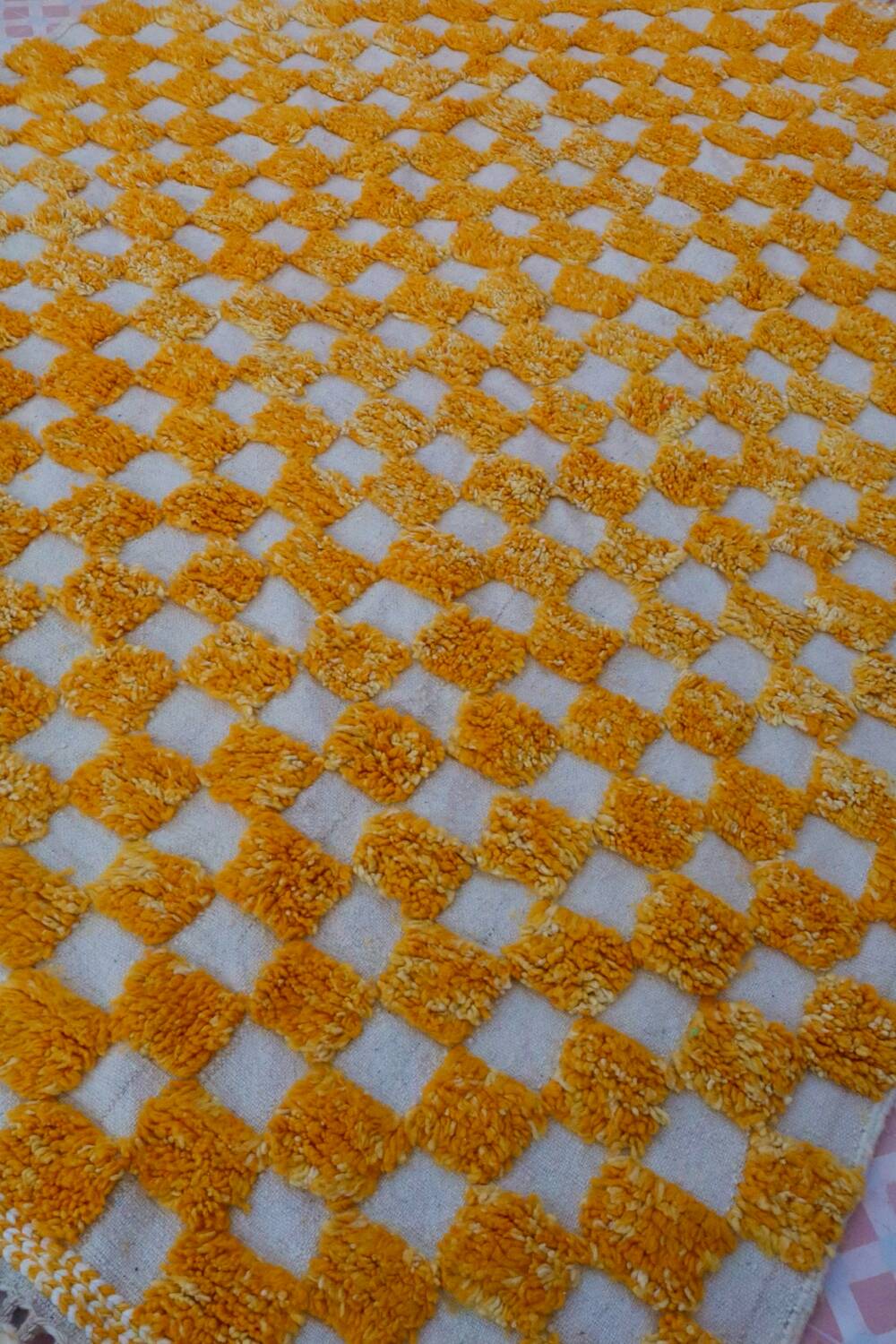 Yellow and white checkered Berber rug