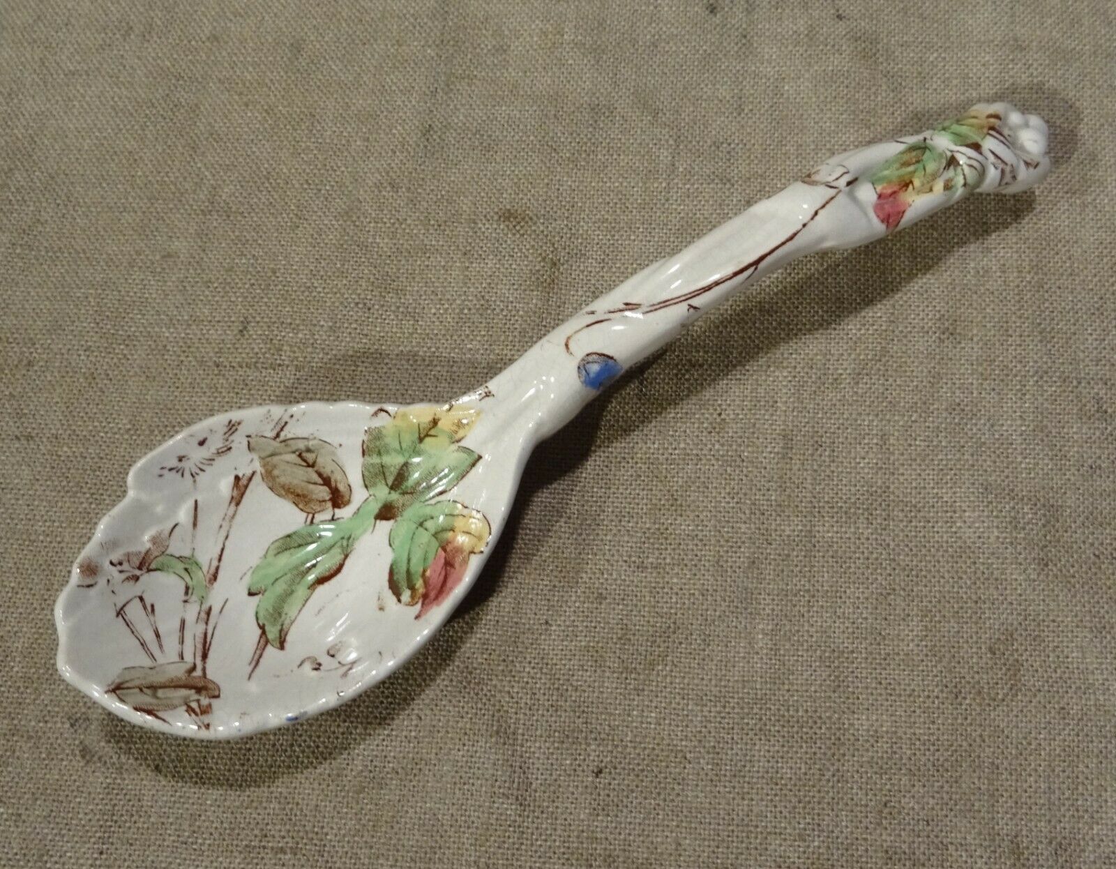 Old spoon with earthenware sauce with floral decoration Longchamp Sarreguemines