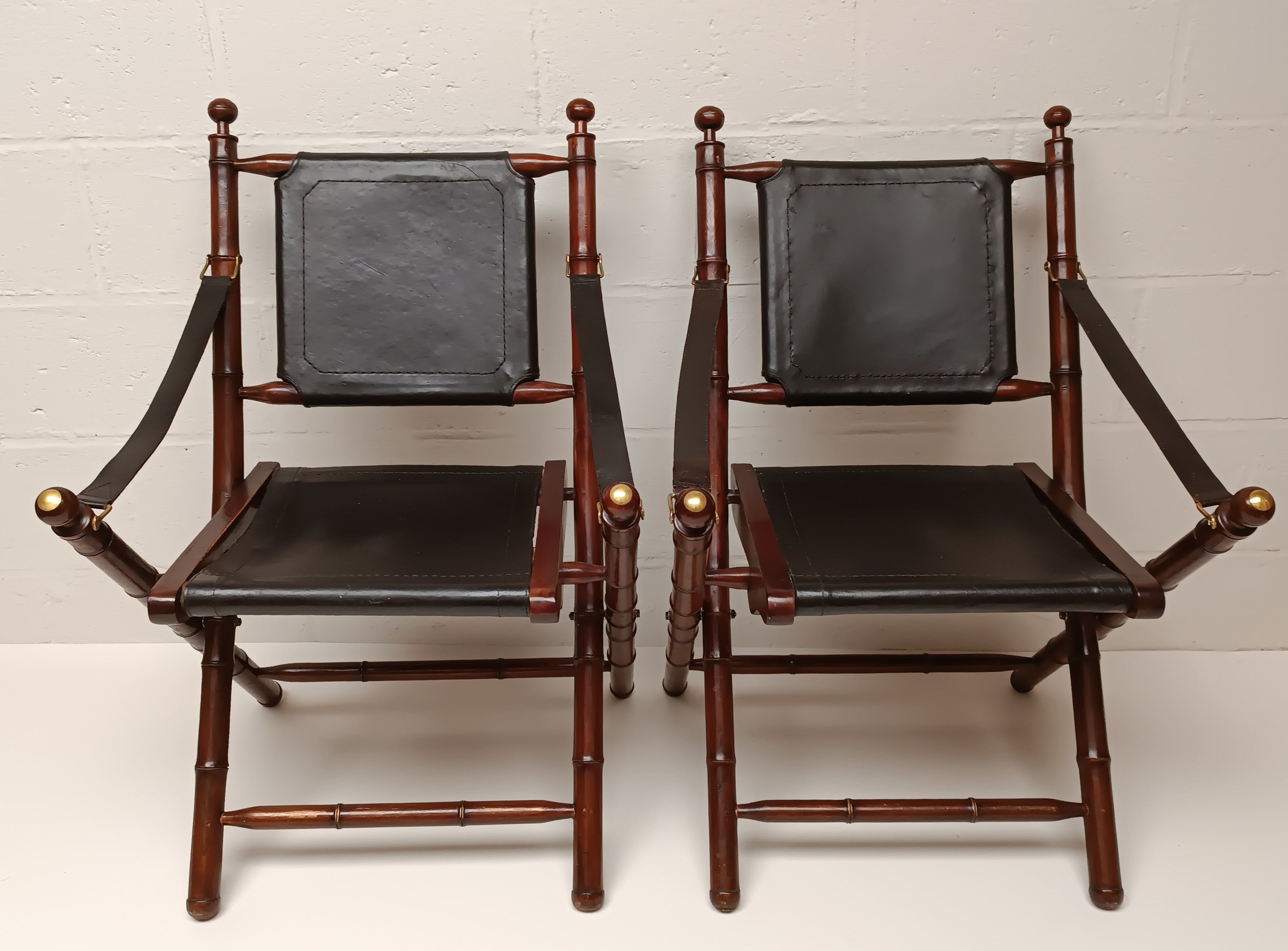 Pair of vintage "safari" folding armchairs in mahogany and leather