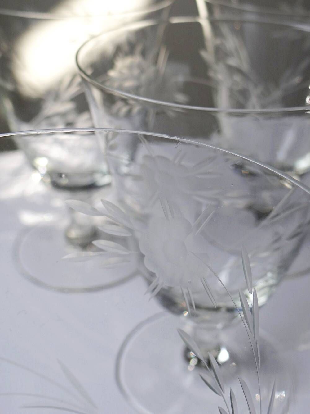 8 engraved crystal wine glasses with a floral design, Bohemia, early 20th century.