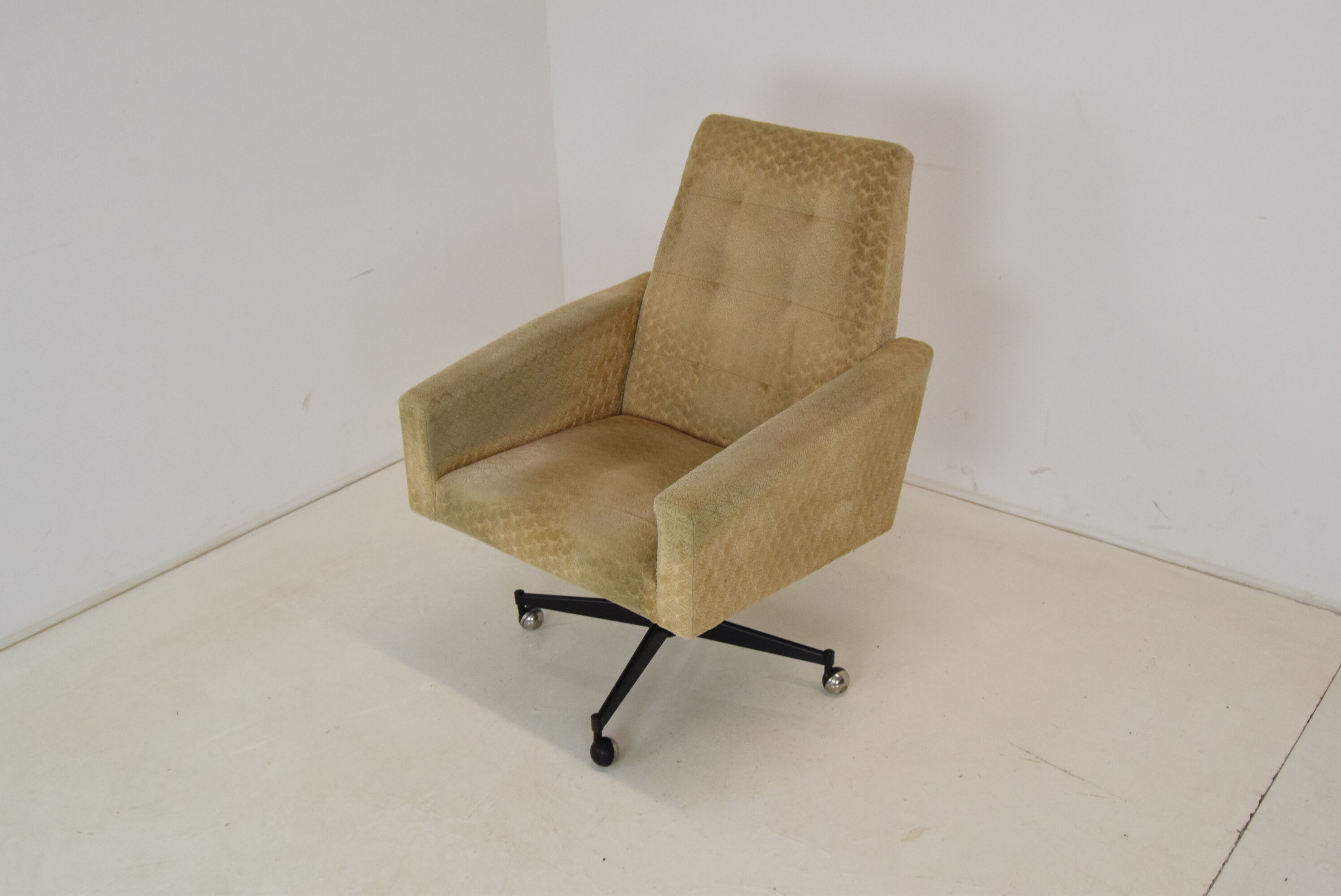 Mid-century swivel armchair with wheels 1970's