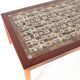 Set of coffee tables in rosewood and ceramic.
