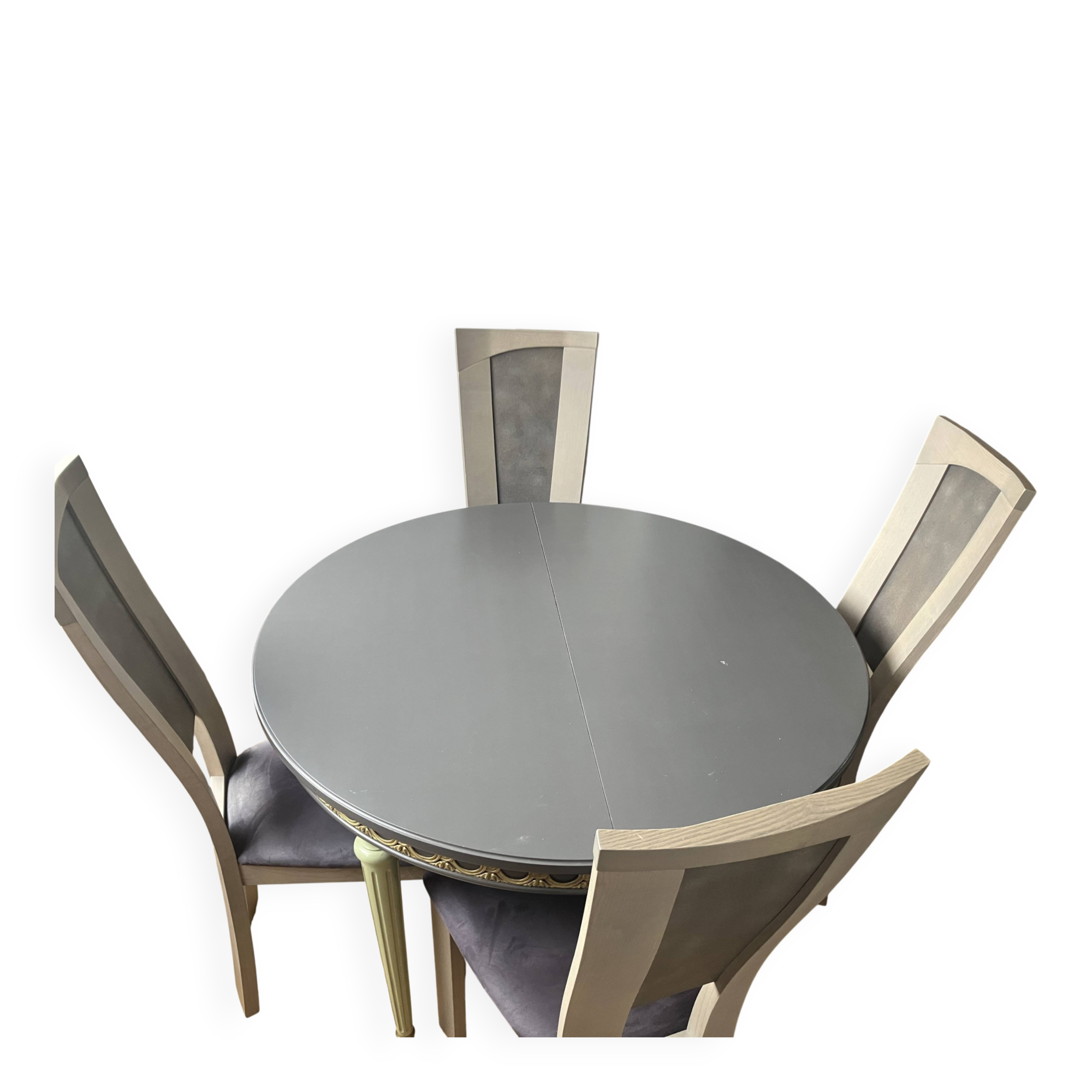 Extendable round table, 2 extensions, and 4 grey velvet chairs.